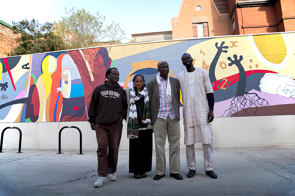 Senegale artists in front of their mural