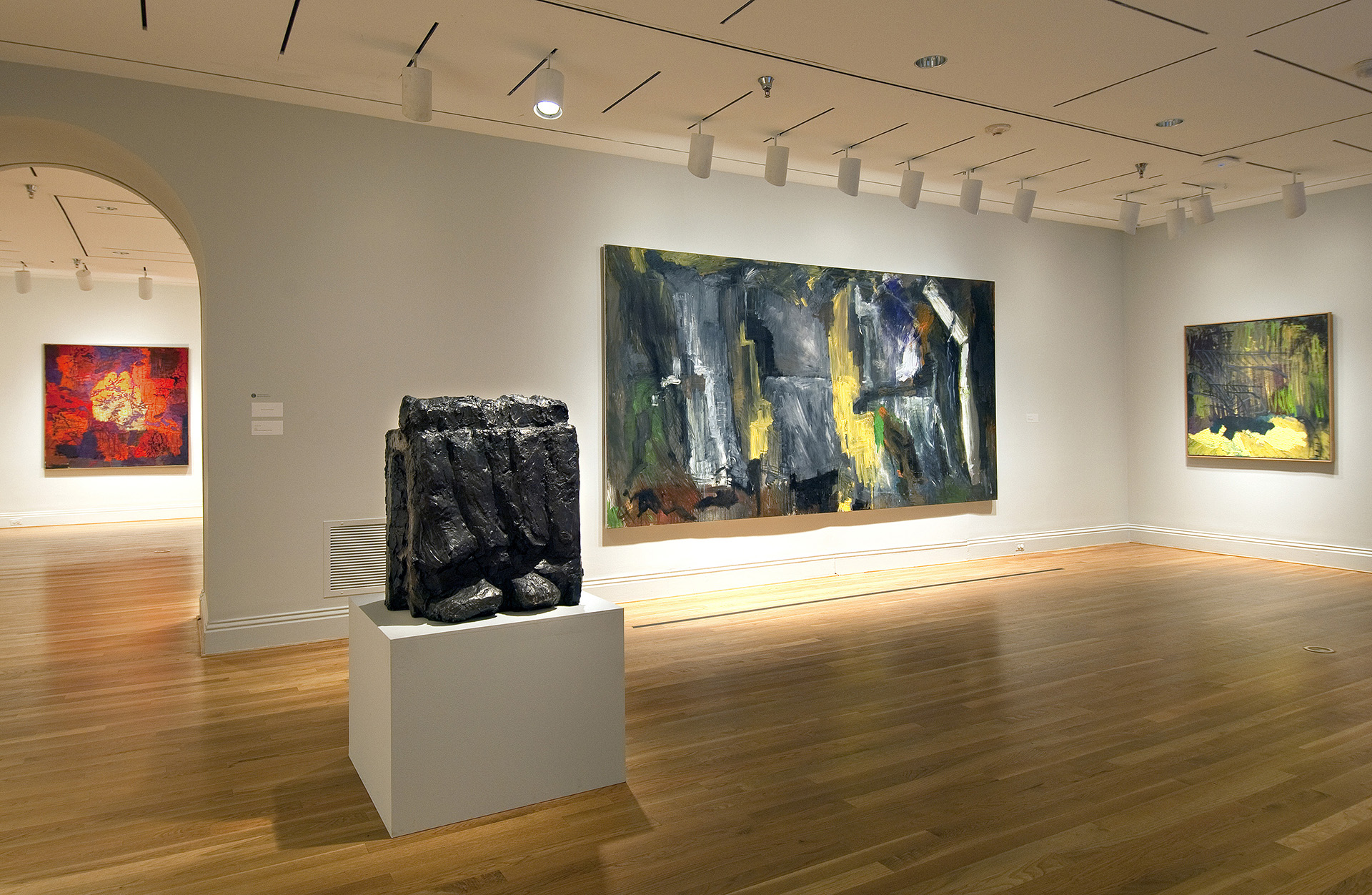 installation view of sculptures and paintings